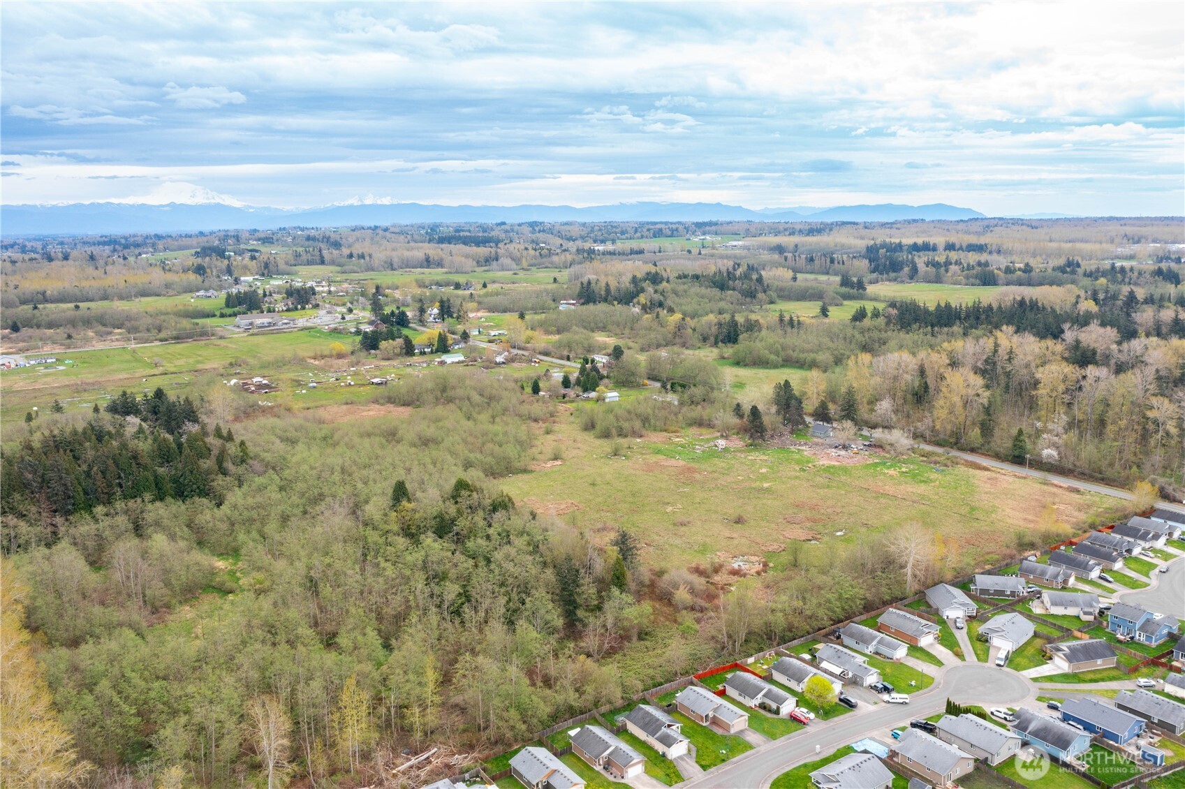 4656 Bay Road Blaine, WA 98230 - Photo 25 of 31 a view of a lake with mountains in the background