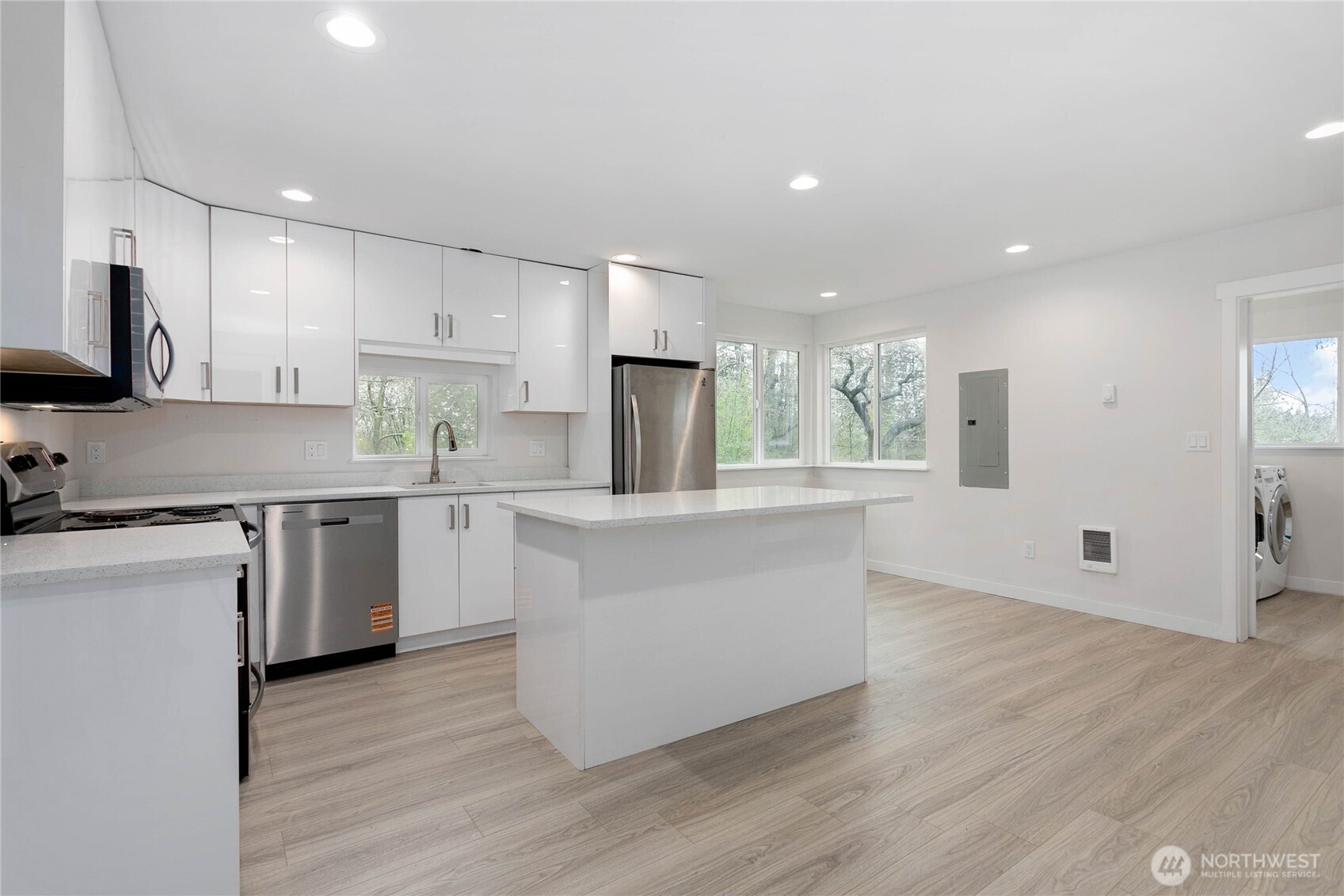 4656 Bay Road Blaine, WA 98230 - Photo 4 of 31 a kitchen with stainless steel appliances granite countertop a stove a sink and a refrigerator
