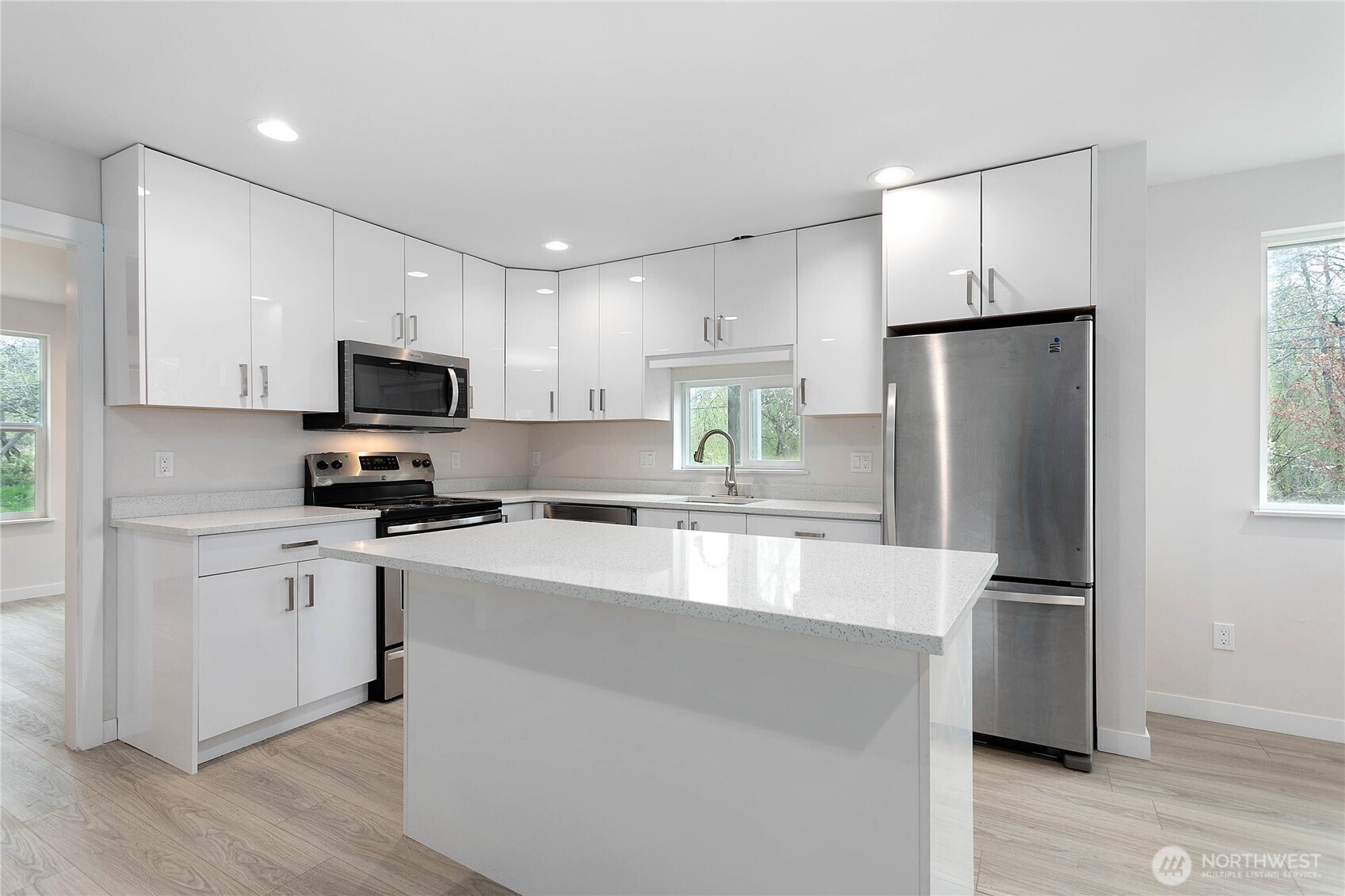 4656 Bay Road Blaine, WA 98230 - Photo 5 of 31 a kitchen with stainless steel appliances a refrigerator sink and microwave