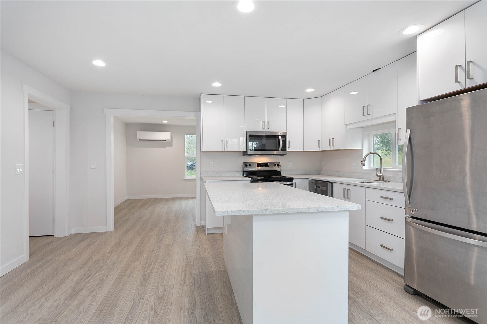 4656 Bay Road Blaine, WA 98230 - Photo 6 of 31 a kitchen with white cabinets and stainless steel appliances