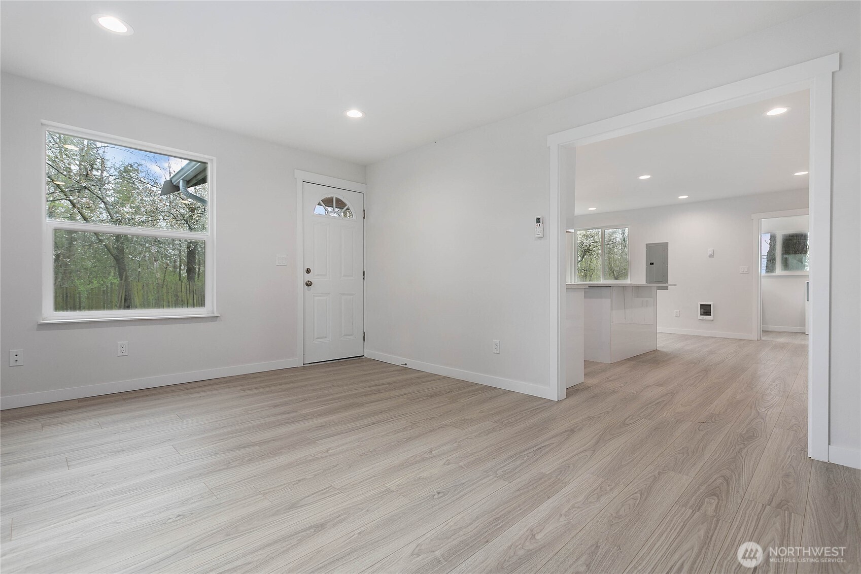 4656 Bay Road Blaine, WA 98230 - Photo 8 of 31 an empty room with wooden floor and windows