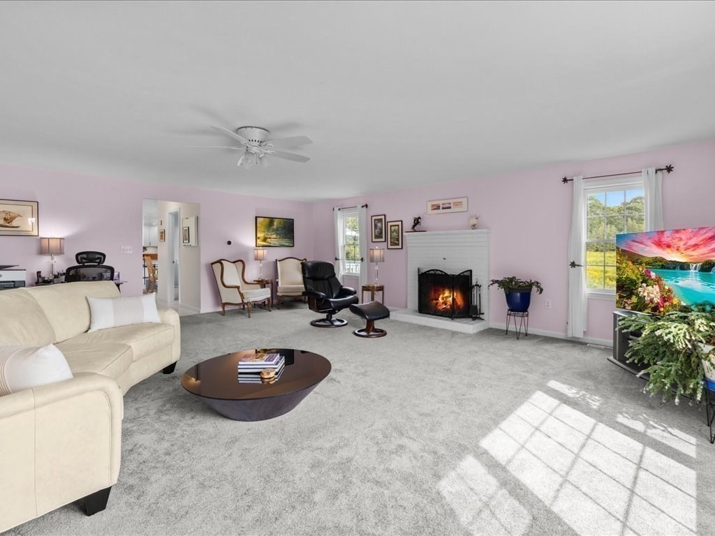 6 Wood Street Upton, MA 01568 - Photo 16 of 40 a living room with furniture and a fireplace