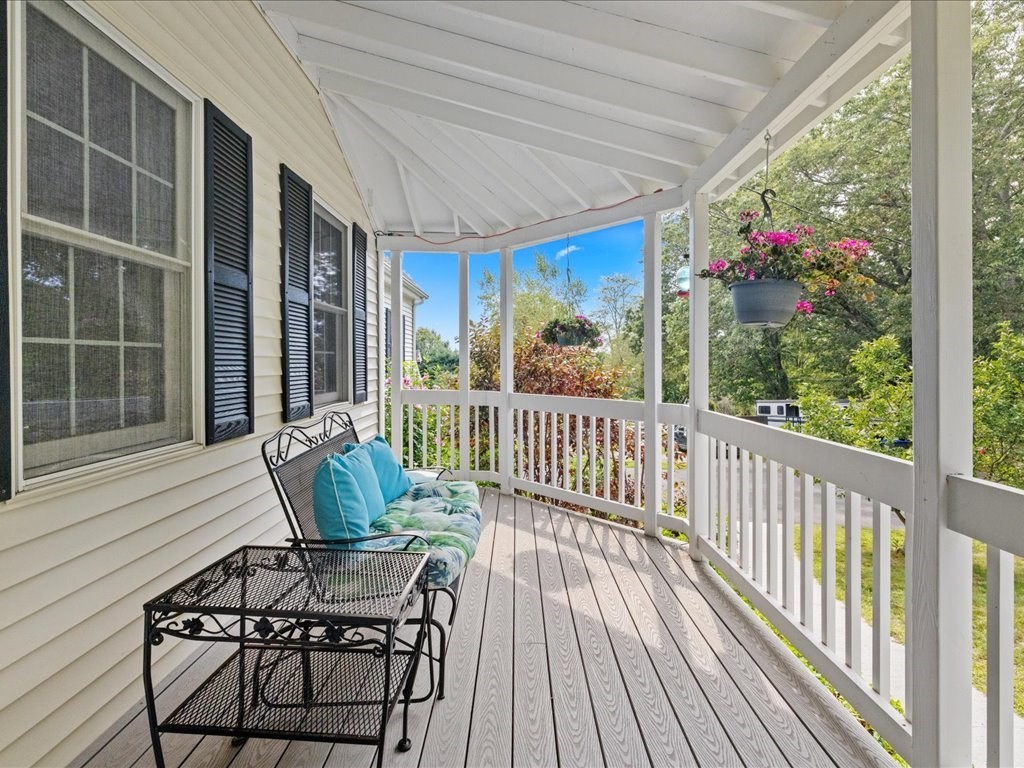 6 Wood Street Upton, MA 01568 - Photo 2 of 40 a view of a chairs on the deck