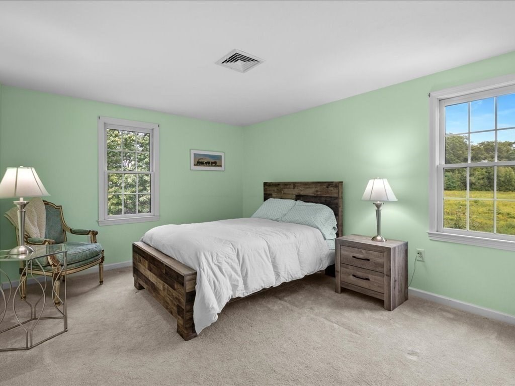 6 Wood Street Upton, MA 01568 - Photo 23 of 40 a bedroom with a bed lamp and a window