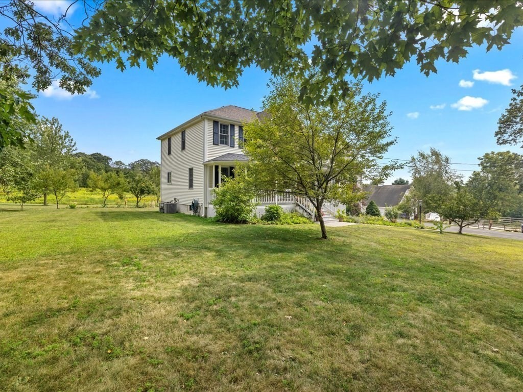 6 Wood Street Upton, MA 01568 - Photo 3 of 40 a view of a house with a big yard