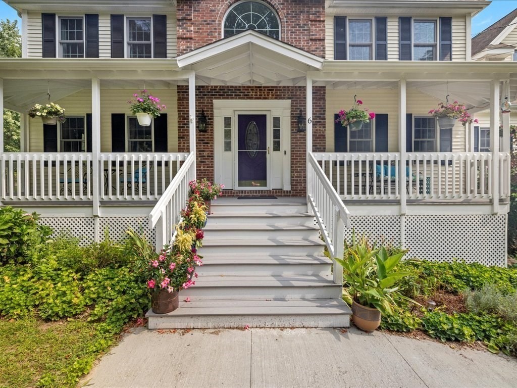 6 Wood Street Upton, MA 01568 - Photo 4 of 40 a front view of a house with a garden