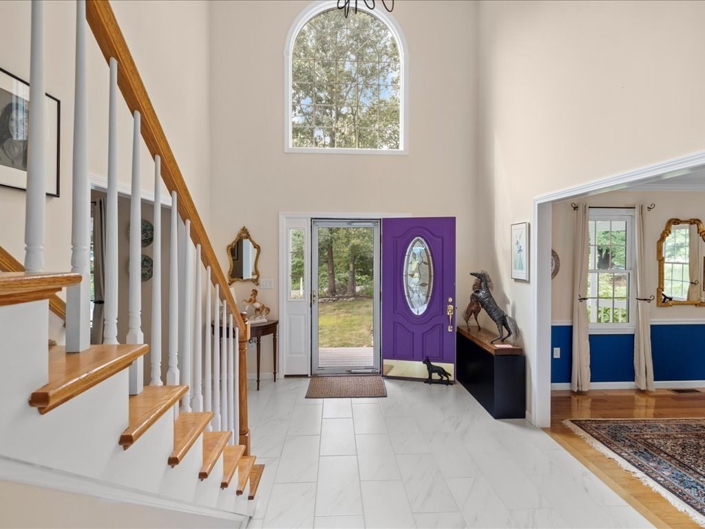 6 Wood Street Upton, MA 01568 - Photo 5 of 40 a view of an entryway with wooden floor