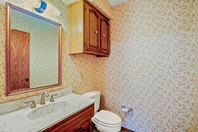 a view of a living room with a fireplace and a flat screen tv