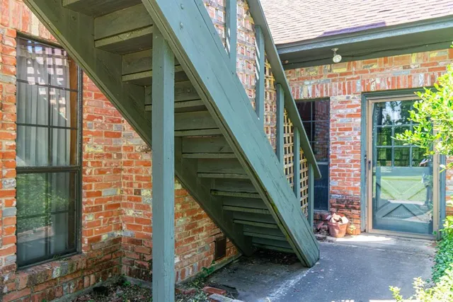 a view of a hallway with entryway