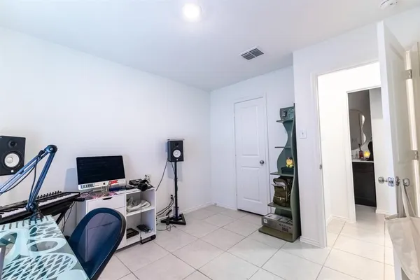 a view of a livingroom with furniture and a flat screen tv