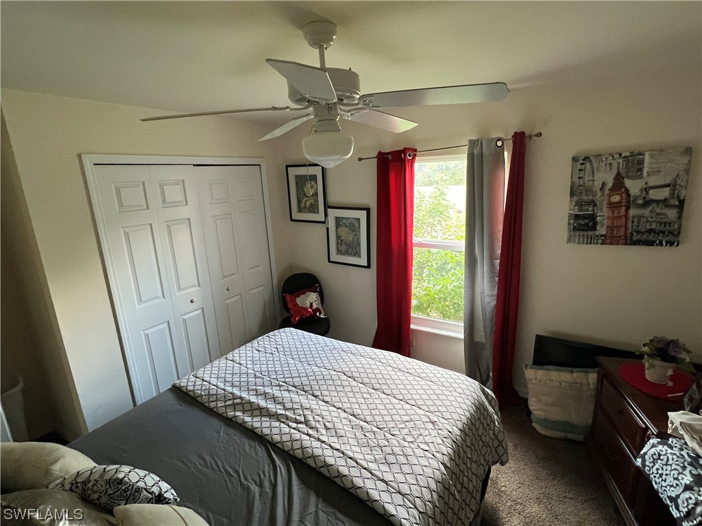 5018 Dolphin Circle LaBelle, FL 33935 - Photo 15 of 17 a bedroom with a large bed and a window