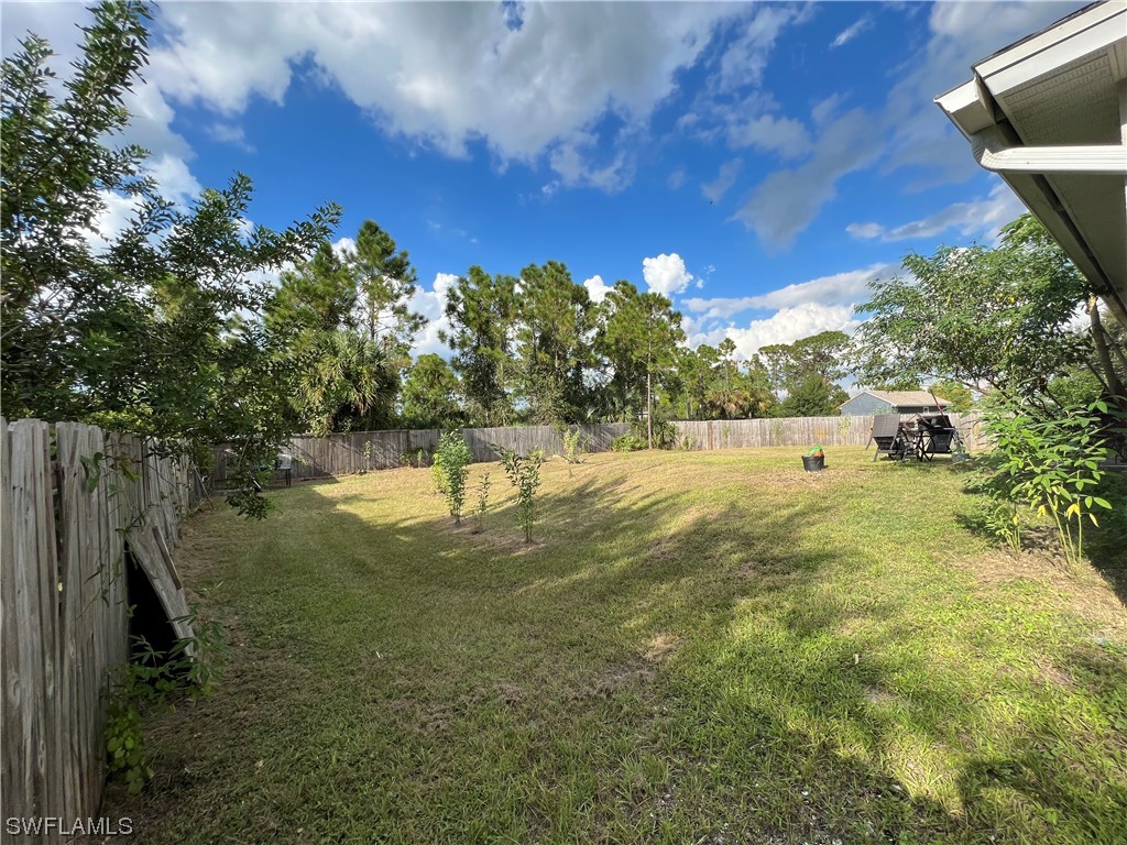 5018 Dolphin Circle LaBelle, FL 33935 - Photo 16 of 17 a view of yard with green space