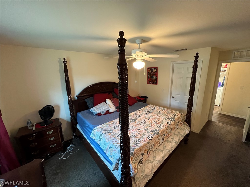 5018 Dolphin Circle LaBelle, FL 33935 - Photo 8 of 17 a bedroom with bed and window