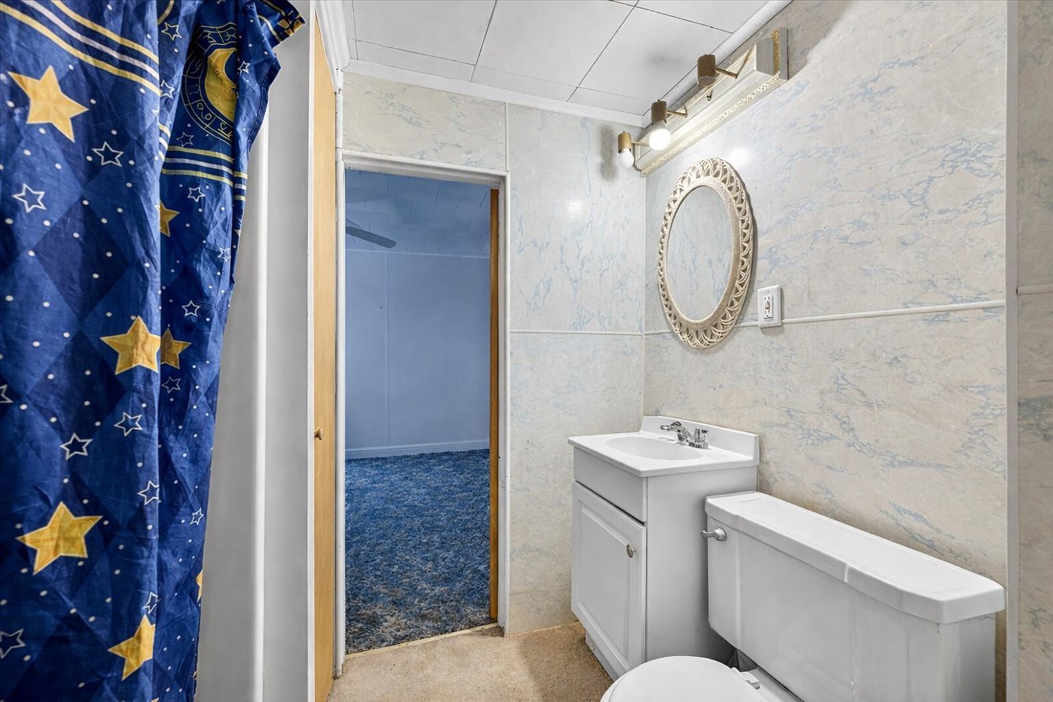 835 North 6th Avenue Canton, IL 61520 - Photo 11 of 14 a bathroom with a sink and mirror with toilet