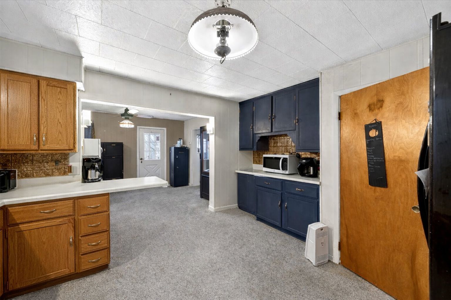 835 North 6th Avenue Canton, IL 61520 - Photo 3 of 14 a kitchen with cabinets a sink and stainless steel appliances