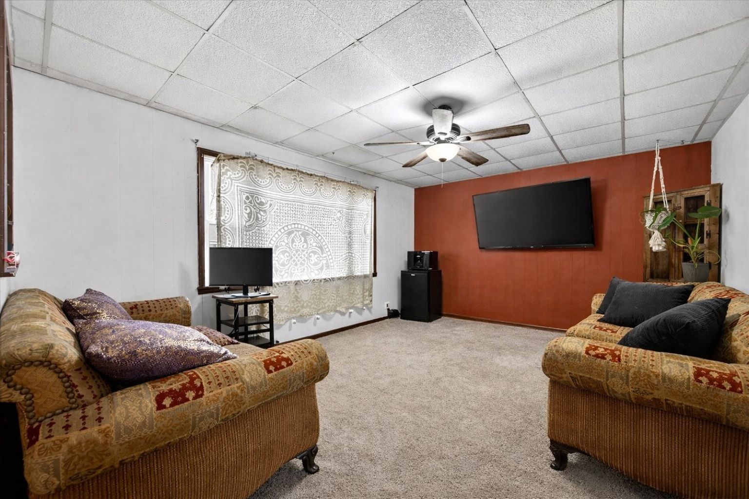 835 North 6th Avenue Canton, IL 61520 - Photo 4 of 14 a living room with furniture and a flat screen tv