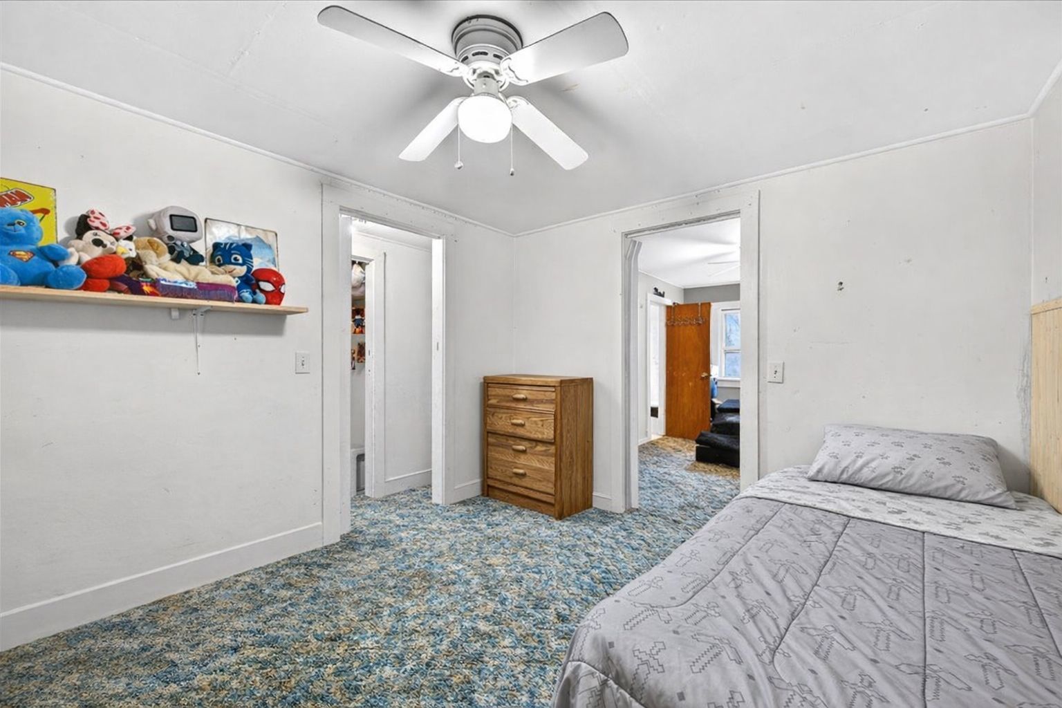 835 North 6th Avenue Canton, IL 61520 - Photo 9 of 14 a bedroom with a bed and a chandelier