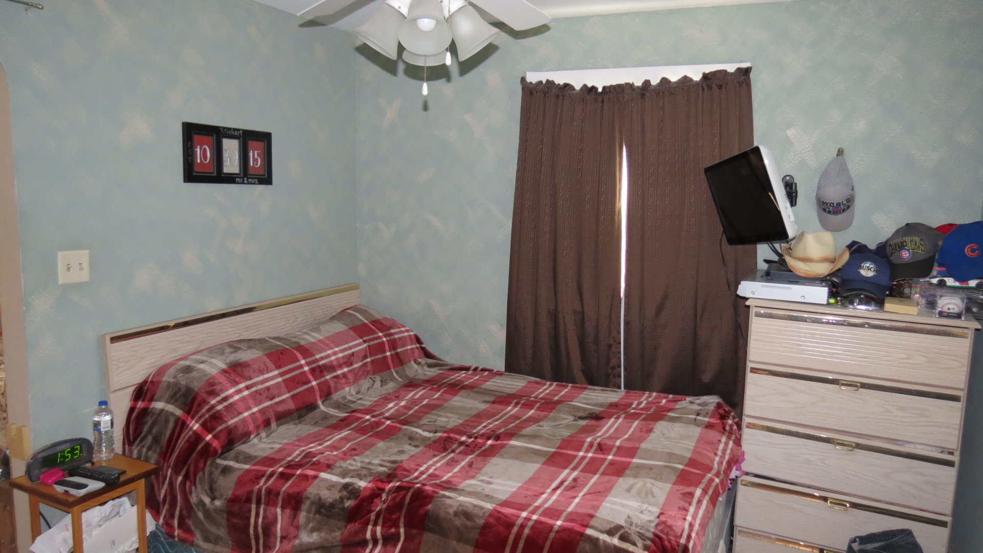 1708 North Center Street Crest Hill, IL 60403 - Photo 8 of 12 a bedroom with a bed and a flat screen tv