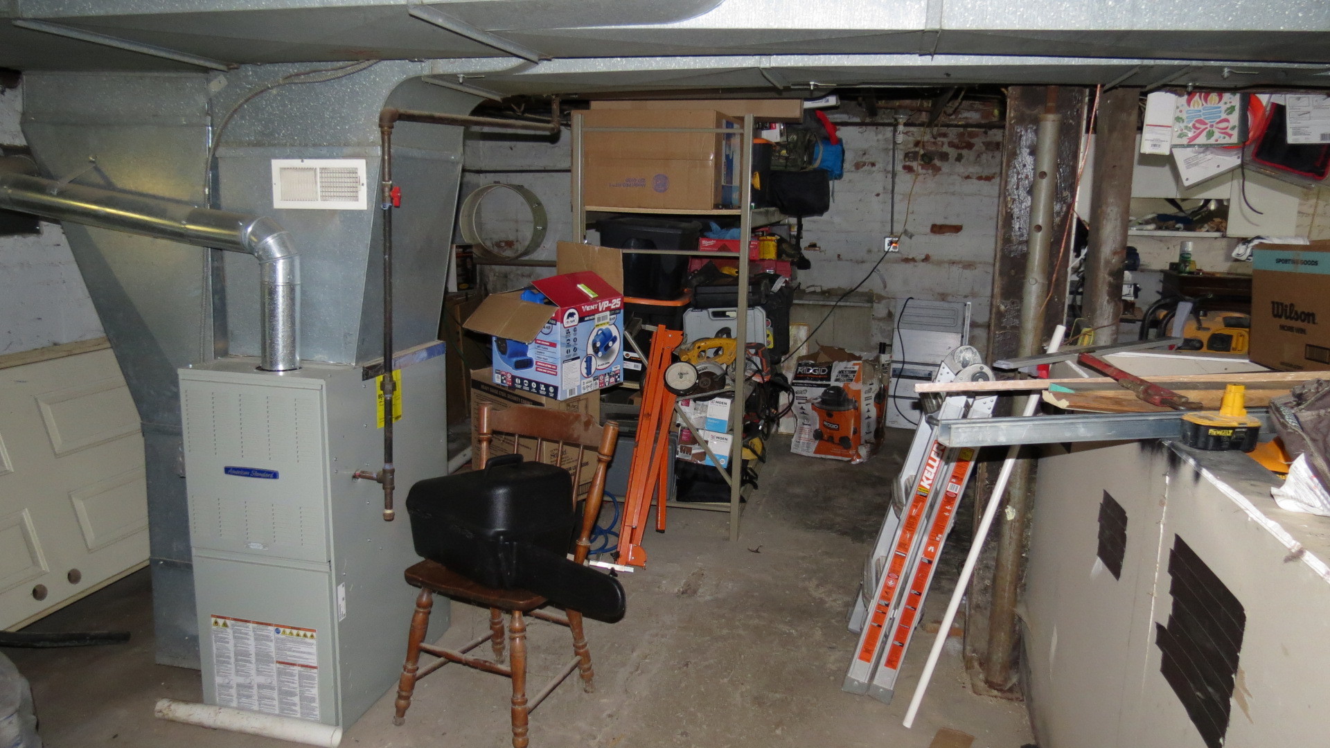 1708 North Center Street Crest Hill, IL 60403 - Photo 10 of 12 a view of walk in closet with clothes and shoes