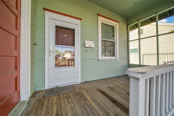 a view of outdoor space and wooden floor