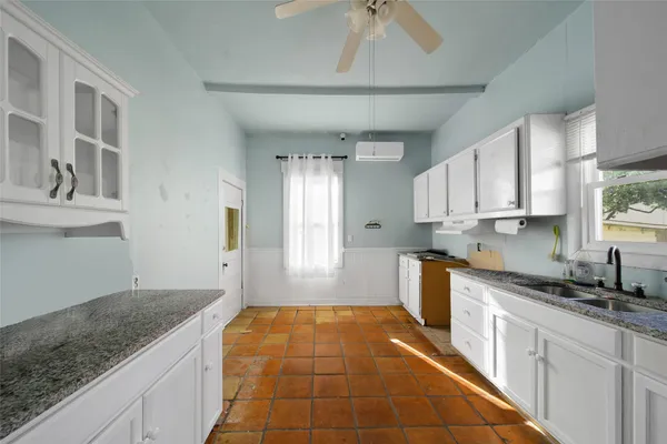 a kitchen with a sink and cabinets