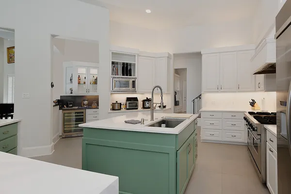 a kitchen with cabinets a sink and appliances