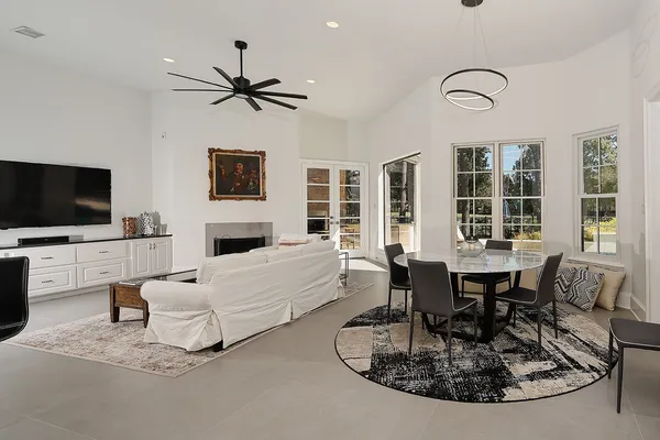 a living room with fireplace furniture and a flat screen tv