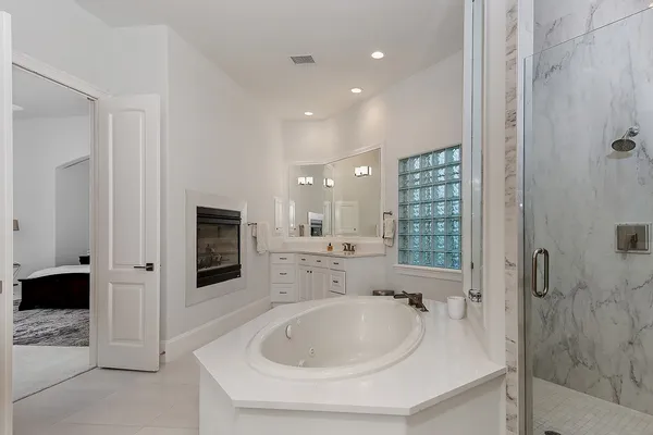 a bathroom with a bathtub and a sink