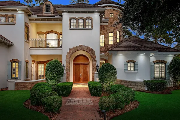 a front view of a house with garden