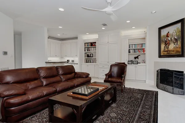 a living room with furniture and a rug