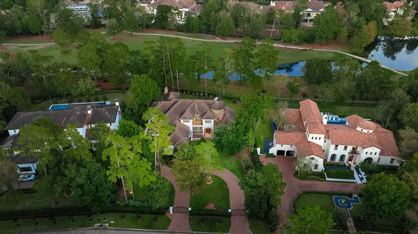 an aerial view of house with yard swimming pool and outdoor seating