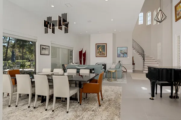 a view of a livingroom with furniture window and wooden floor