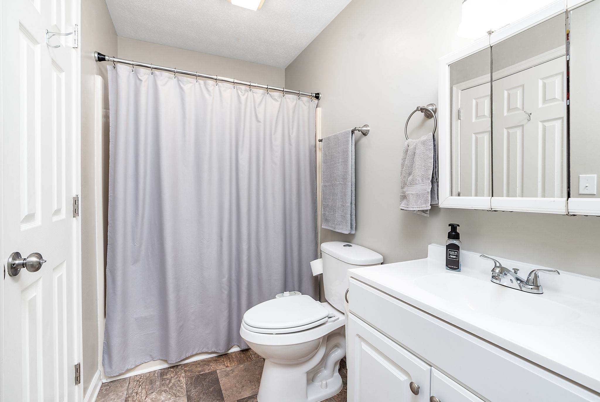 99 Harvest Road Waynesboro, VA 22980 - Photo 12 of 36 a bathroom with a sink a toilet and a mirror