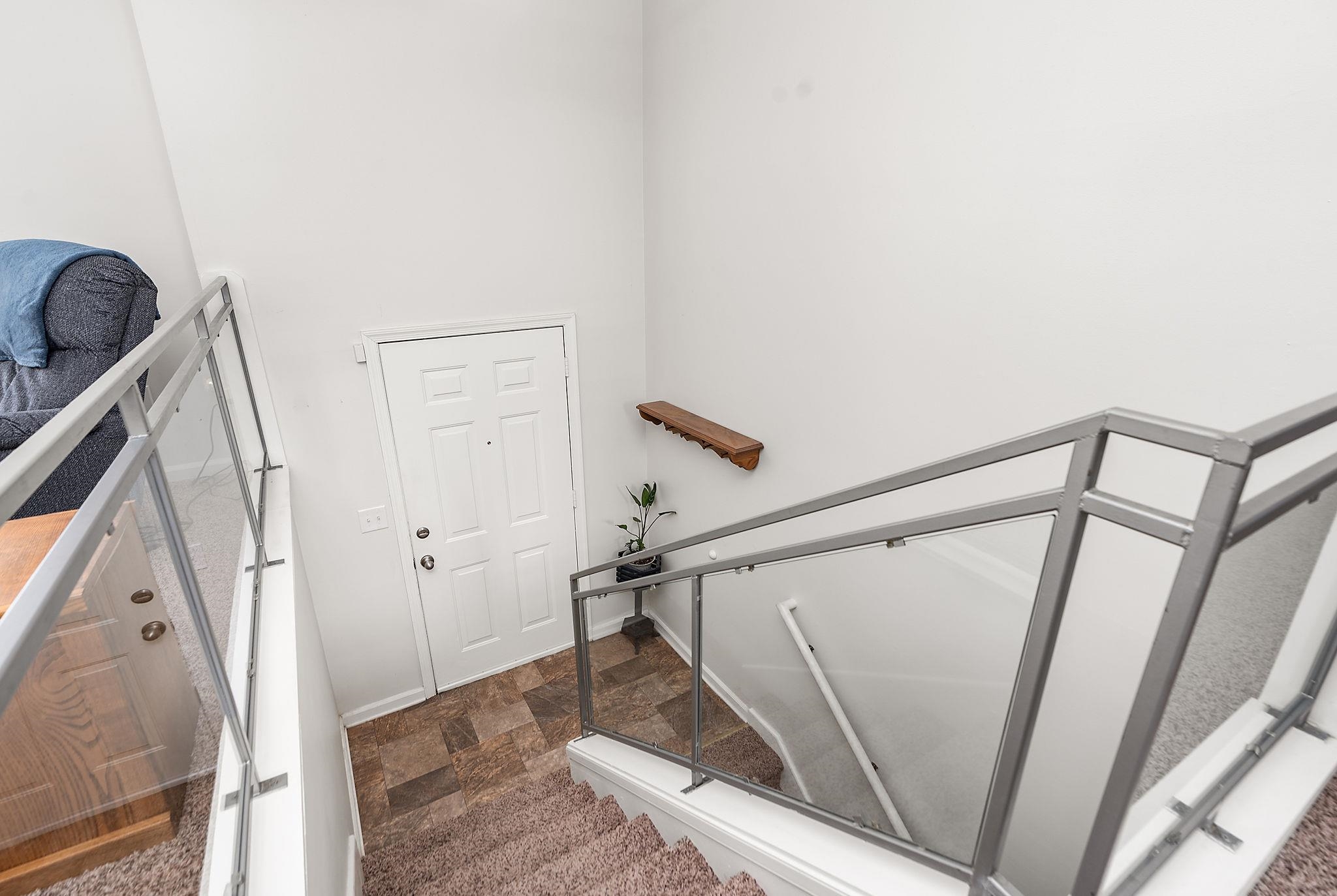 99 Harvest Road Waynesboro, VA 22980 - Photo 16 of 36 a view of staircase with white walls and railing