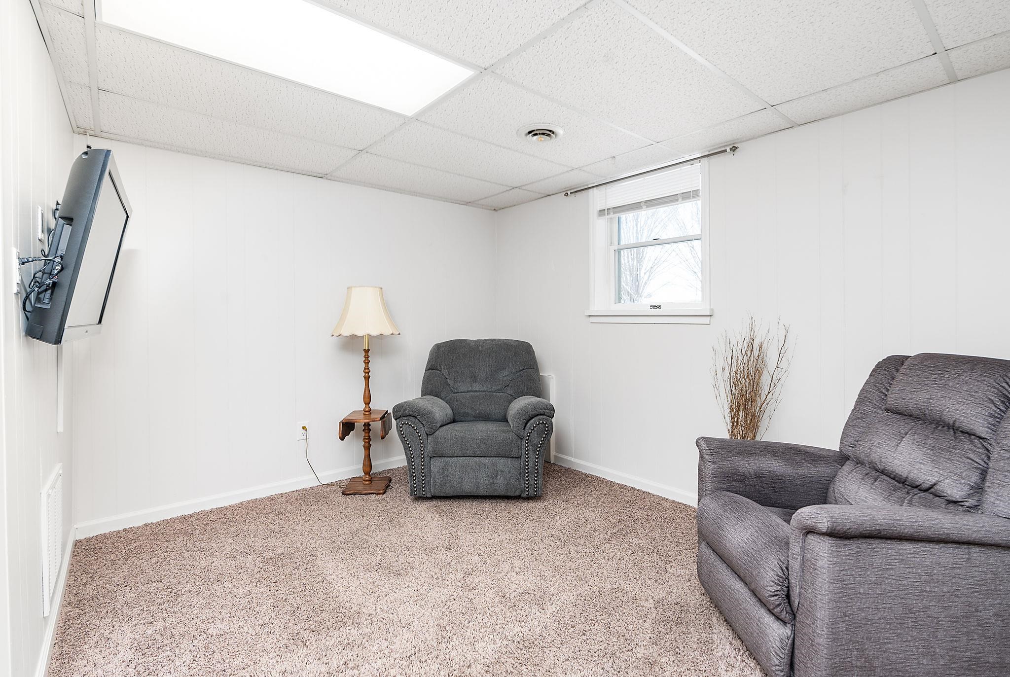 99 Harvest Road Waynesboro, VA 22980 - Photo 18 of 36 a living room with furniture and a window
