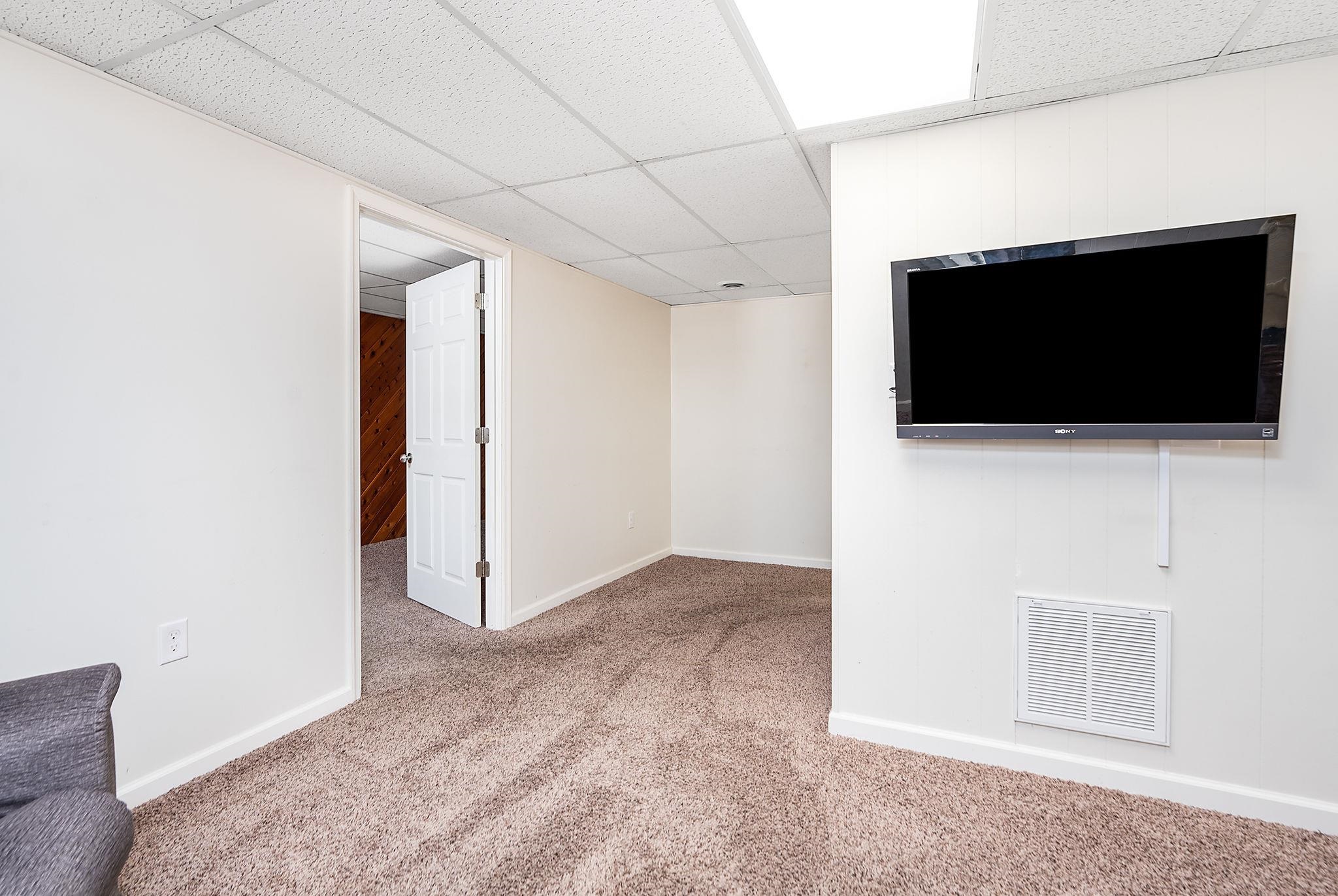 99 Harvest Road Waynesboro, VA 22980 - Photo 19 of 36 a view of a livingroom with a flat screen tv