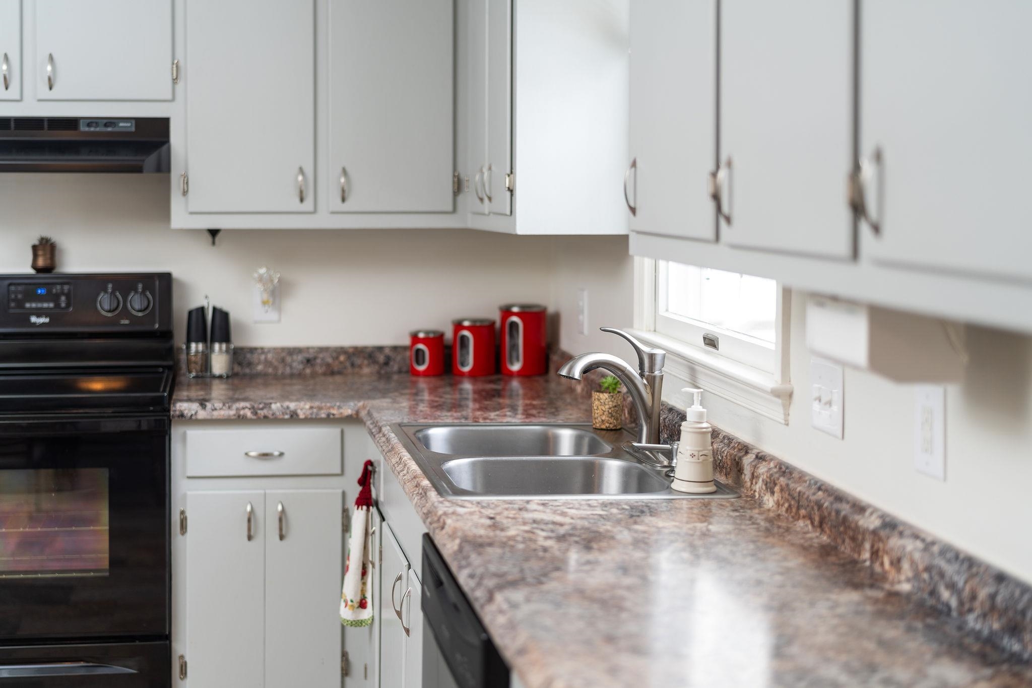 99 Harvest Road Waynesboro, VA 22980 - Photo 4 of 36 a kitchen with granite countertop white cabinets and a sink
