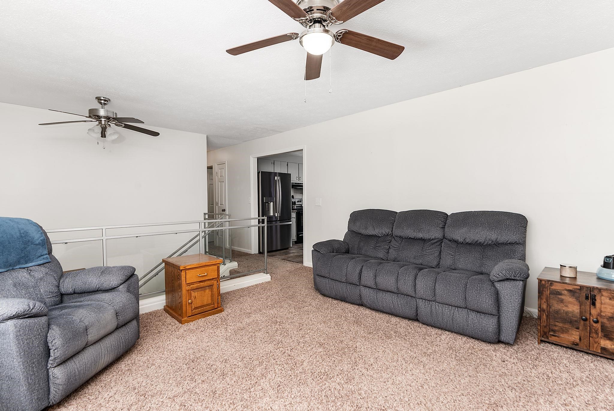 99 Harvest Road Waynesboro, VA 22980 - Photo 9 of 36 a living room with furniture and a ceiling fan