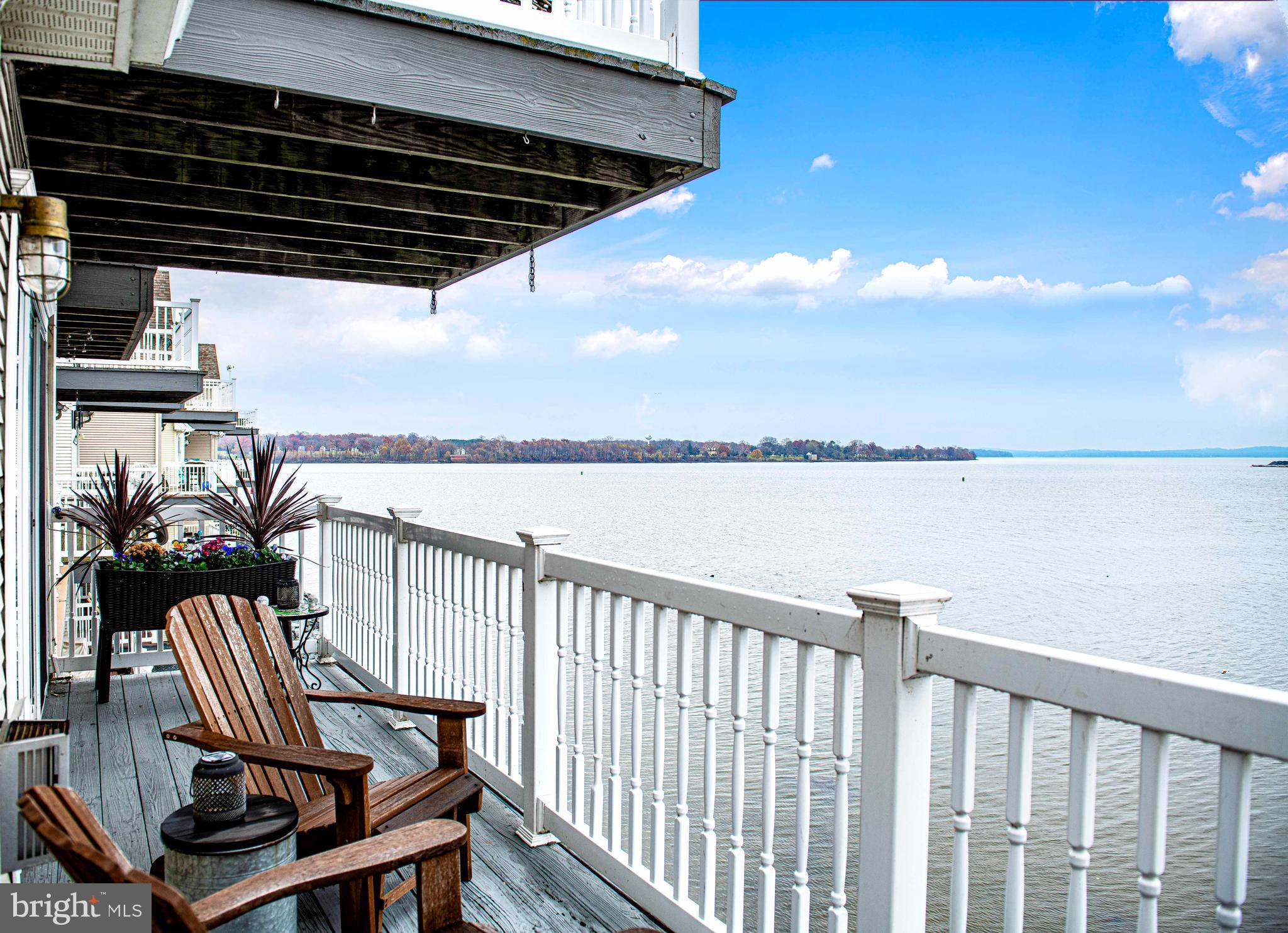203 Pointe Way, Unit 53 Havre de Grace, MD 21078 - Photo 13 of 29 a view of a balcony with wooden floor next to a yard