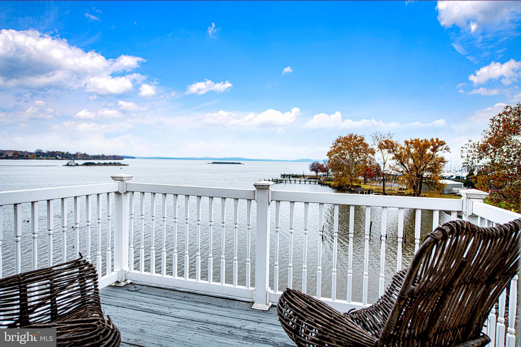 203 Pointe Way, Unit 53 Havre de Grace, MD 21078 - Photo 20 of 29 a view of roof deck with two chairs and wooden floor