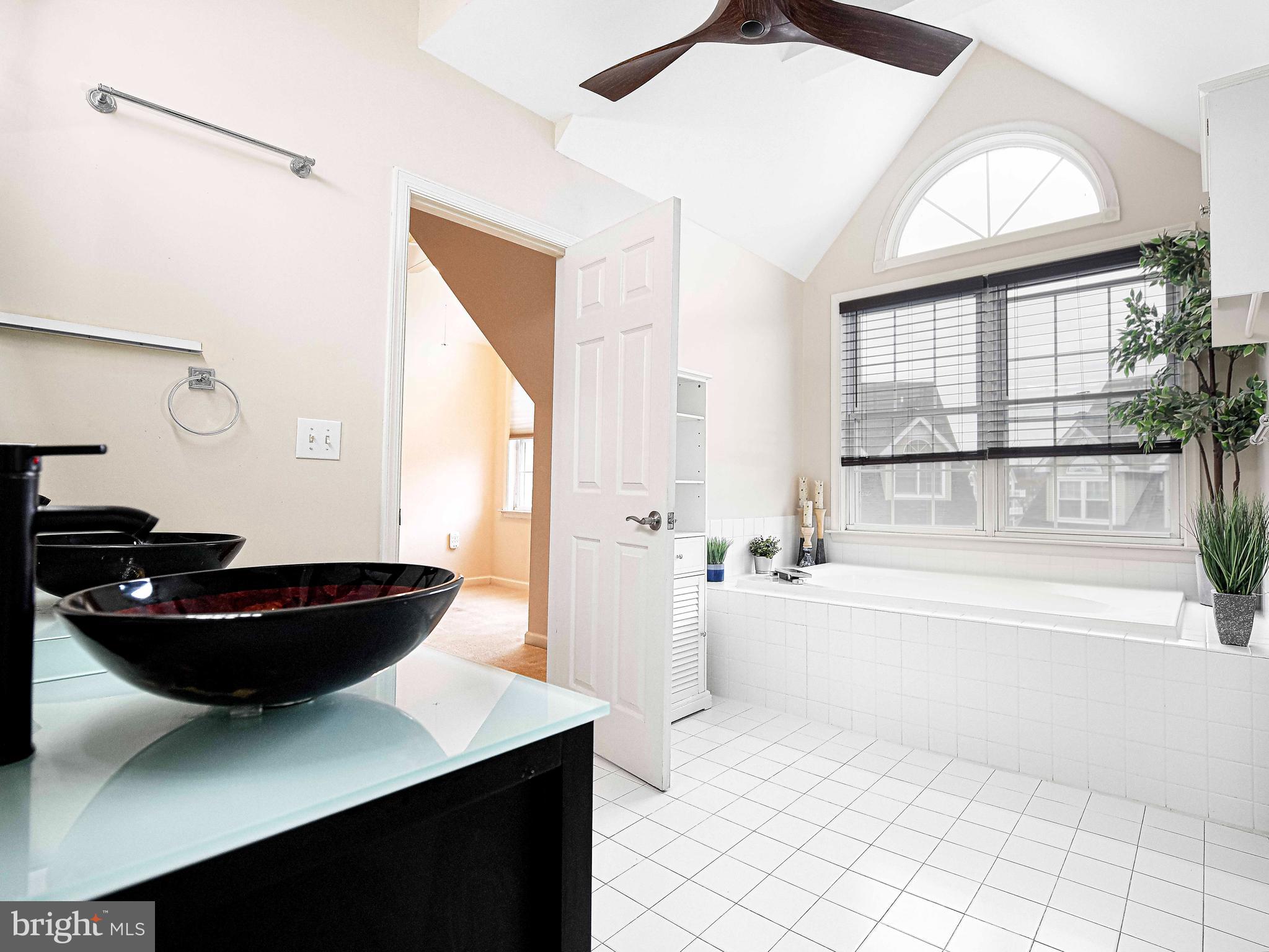 203 Pointe Way, Unit 53 Havre de Grace, MD 21078 - Photo 4 of 29 a living room with a table chairs and a window