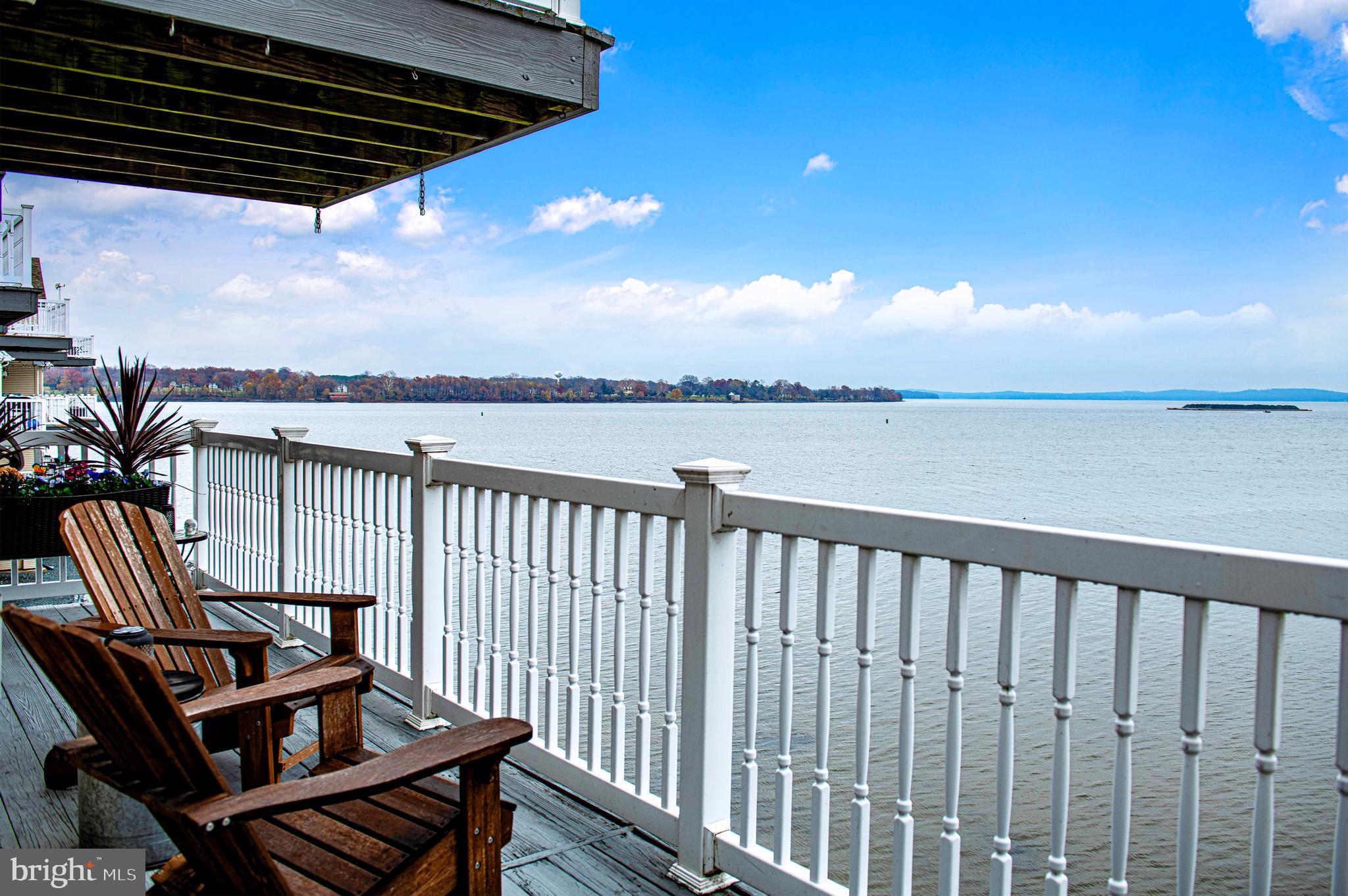 203 Pointe Way, Unit 53 Havre de Grace, MD 21078 - Photo 5 of 29 a view of a balcony with wooden floor and outdoor seating