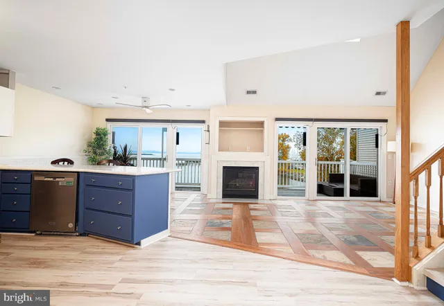 a view of a kitchen with furniture and a fireplace