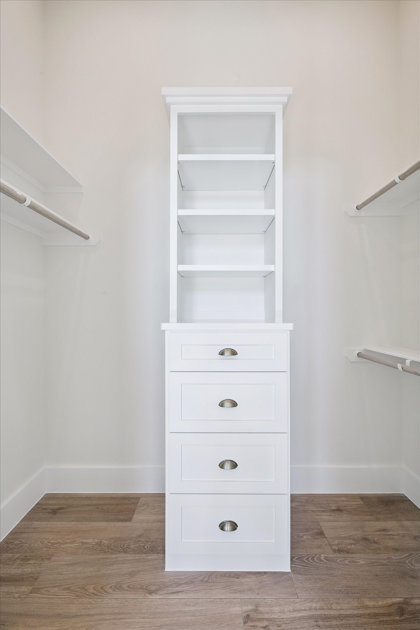 65 Shadow Creek Ridge Drive Spring, TX 77389 - Photo 24 of 41 Custom walk-in closet shines with built-in drawers, open shelving, and double hanging rods.