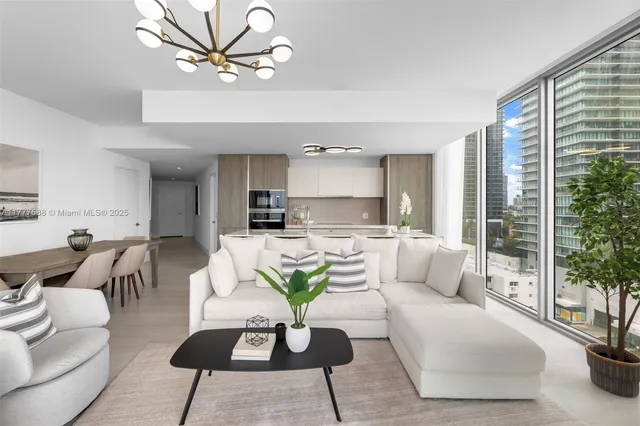a kitchen with a sink and a potted plant