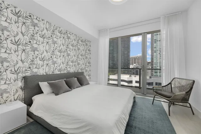 a bathroom with a sink shower and mirror