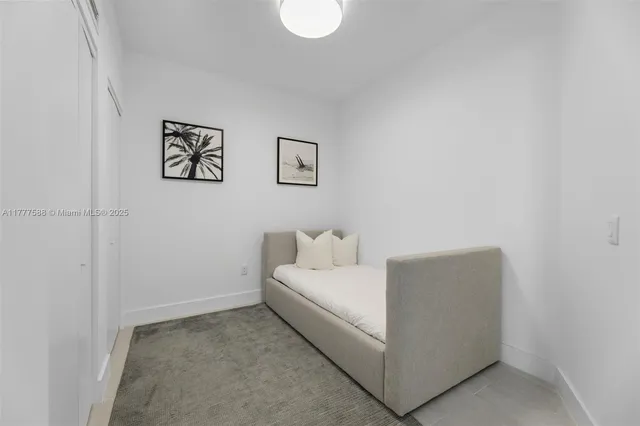 a view of living room with patio furniture and potted plants