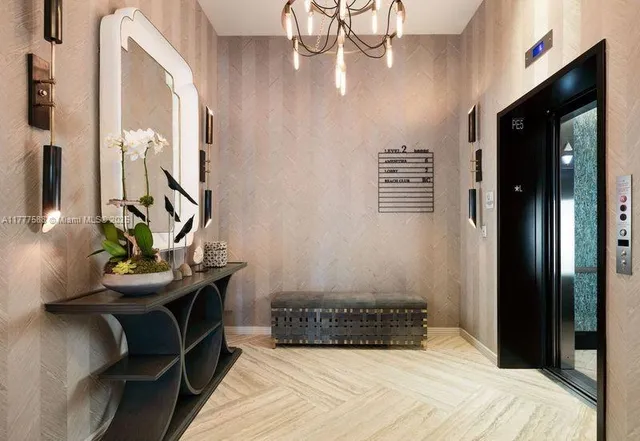 a view of ocean with palm trees