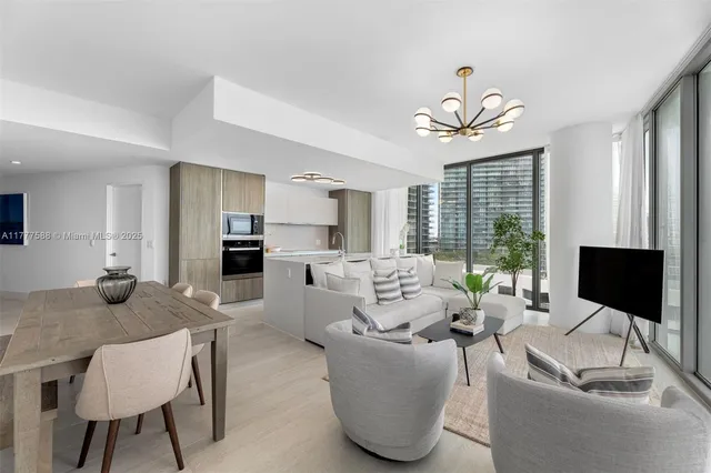 a kitchen with stainless steel appliances granite countertop a sink and stove