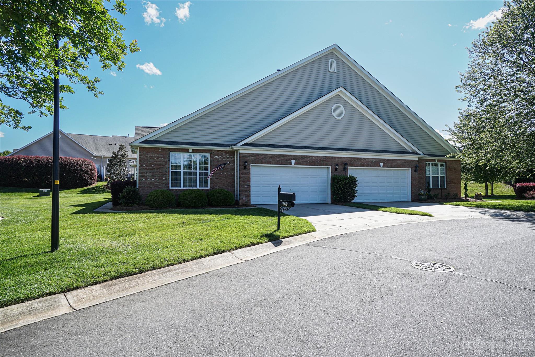 662 Amethyst Circle Fort Mill, SC 29708 - Photo 1 of 34 a front view of a house with a yard and garage